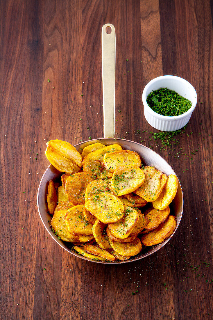 Homemade chips with parsley