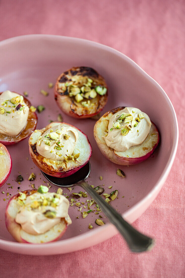 Roasted white nectarines with tahini cream and pistachios