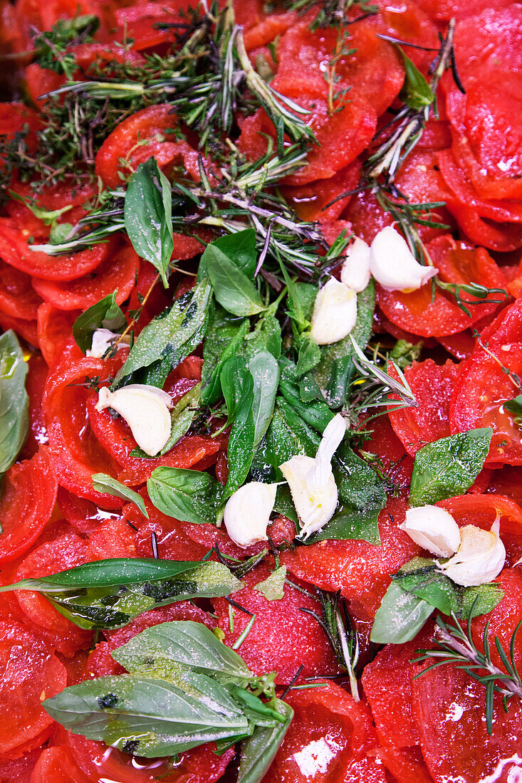 Tomatoes with rosemary, Thai basil and garlic