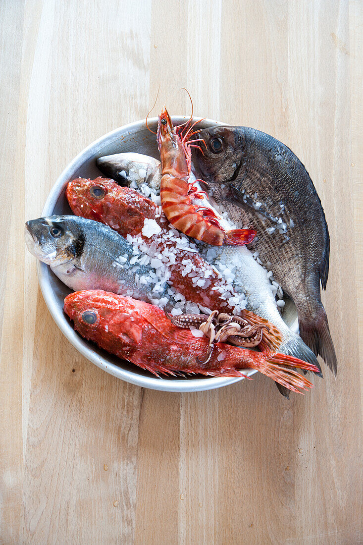 Fresh fish and seafood with ice in a bowl