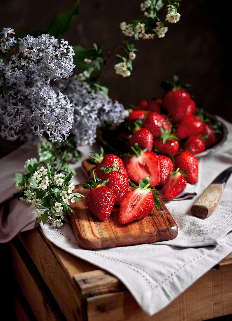 Fresh strawberries and lilac blossoms