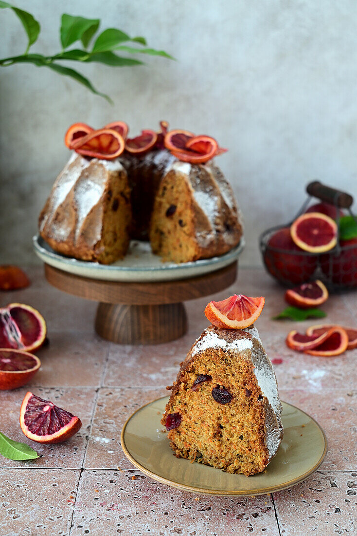 Carrot cake with orange peel, dried cherries, and nuts