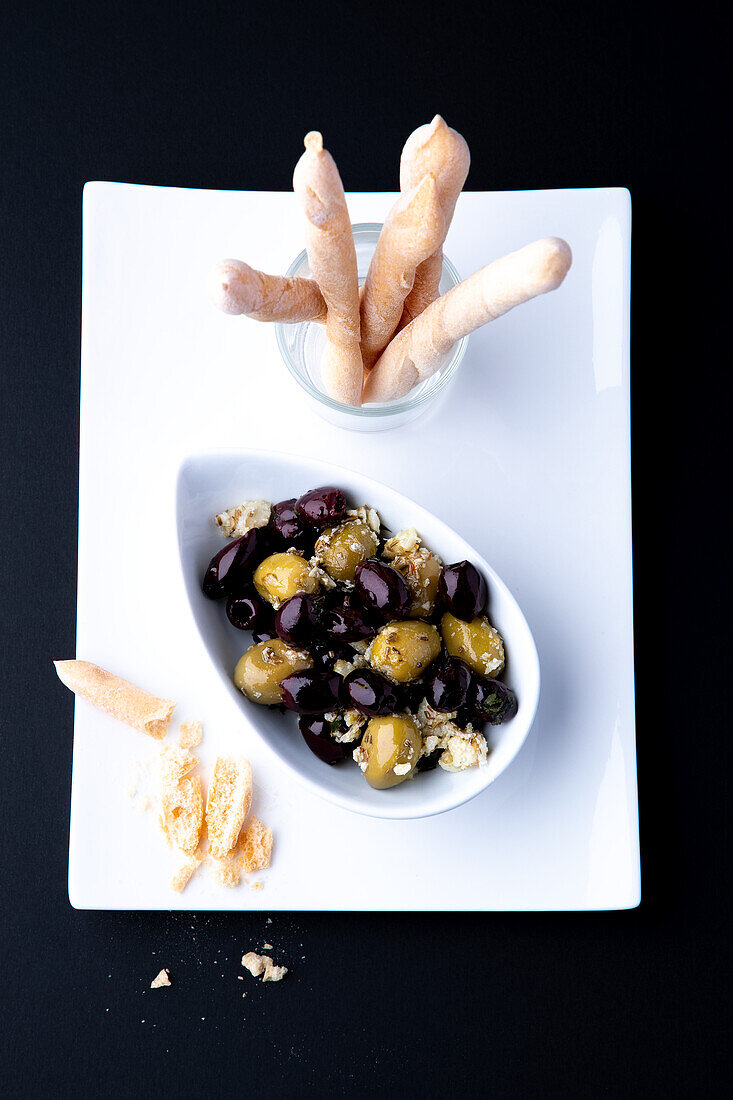 Grissini and pickled black and green olives