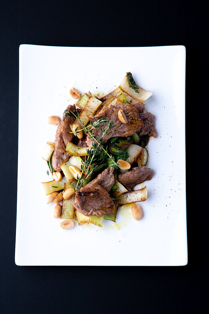 Chicory with beef and peanuts