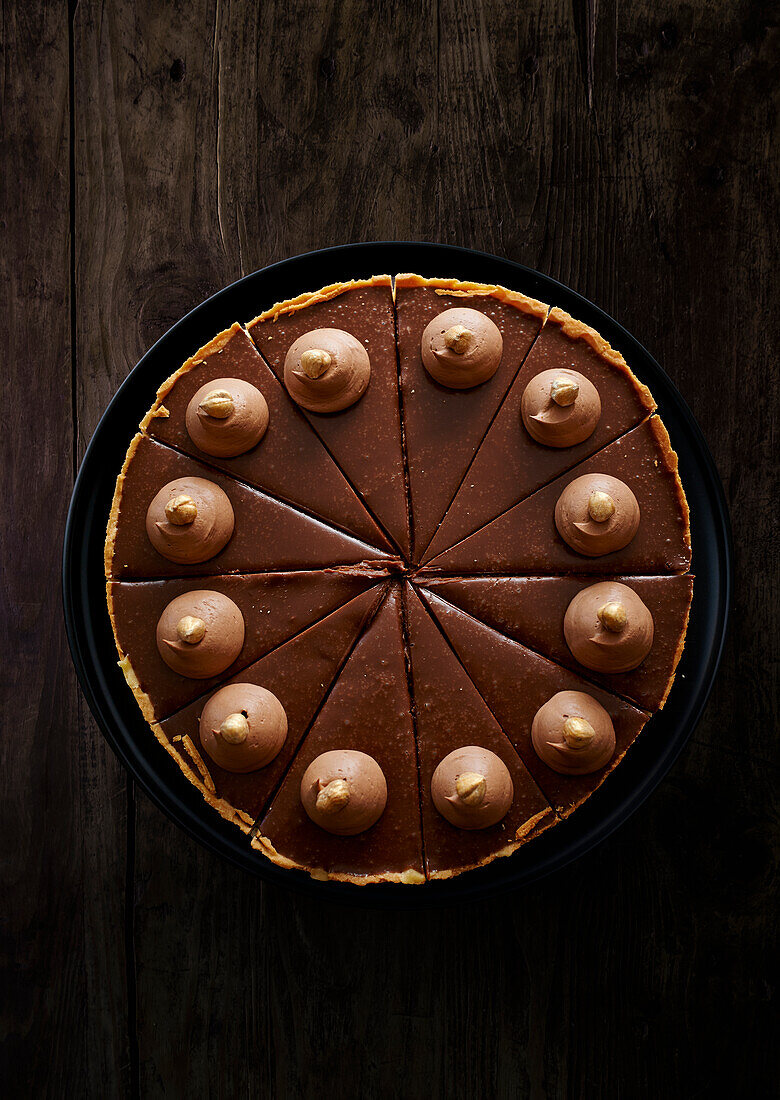 Chocolate tart with hazelnut cream dots