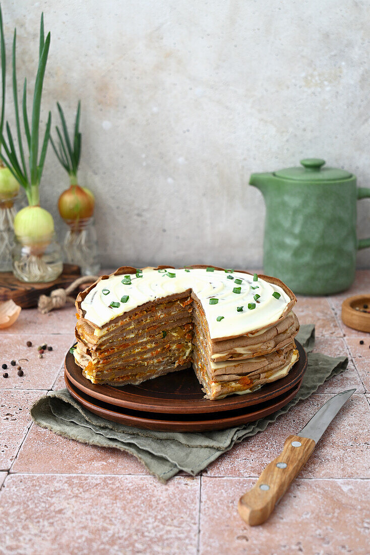 Liver crêpe cake with onions, carrots, and mayonnaise cream