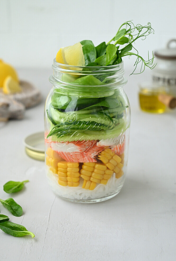 Salad with glass noodles, corn, surimi crab and cucumber