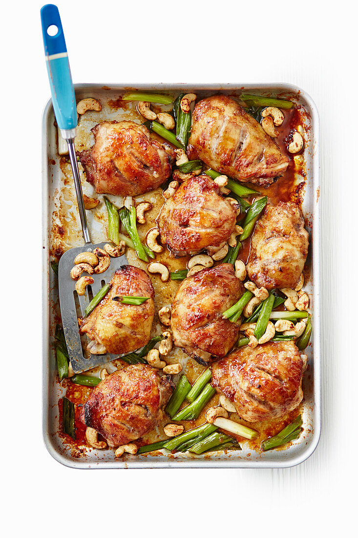 Chinese sticky chicken from the tray with cashew nuts