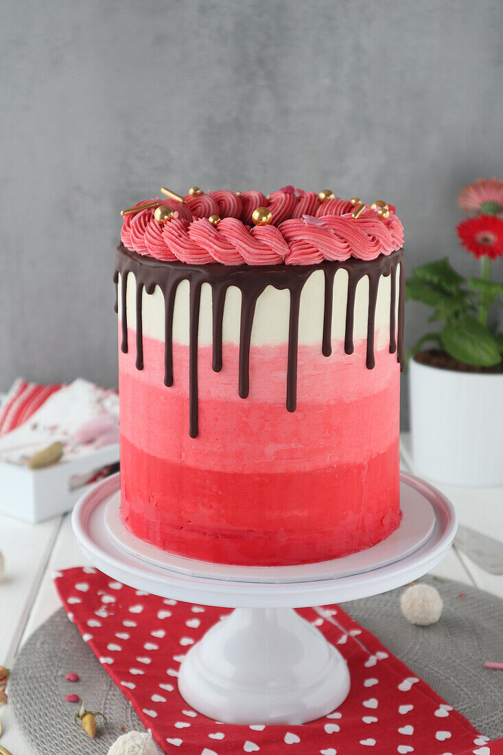 Ombre cake with drip and swirl in red