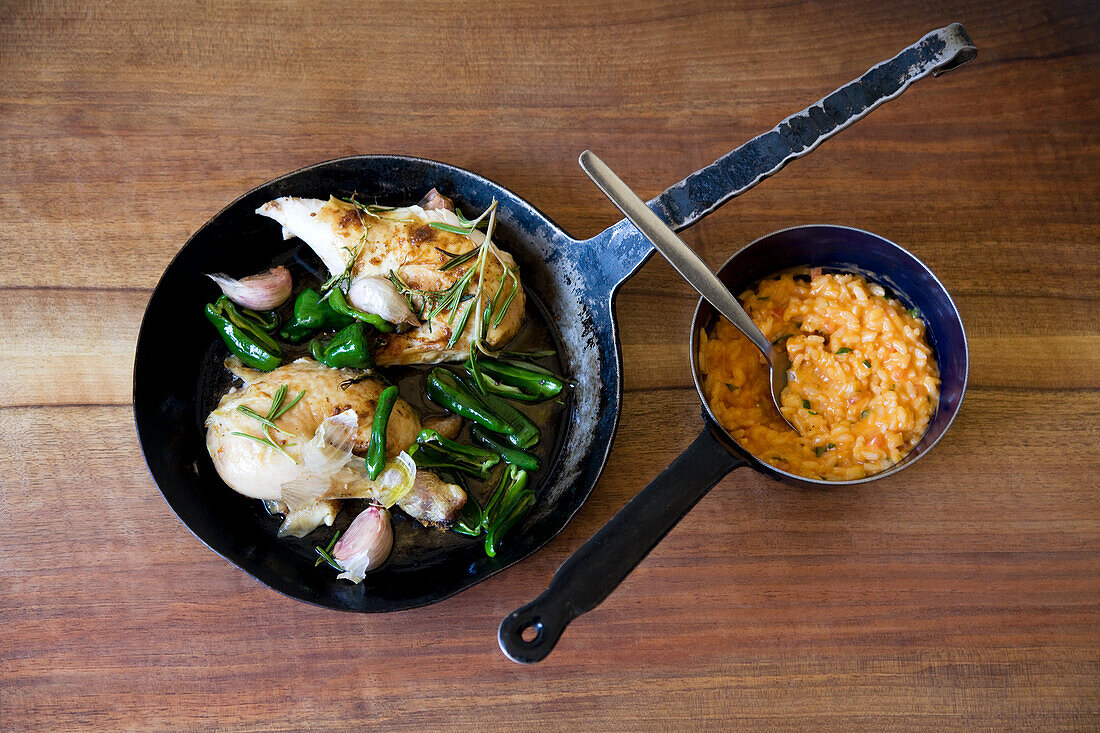 Roasted chicken pieces with green peppers and pumpkin risotto