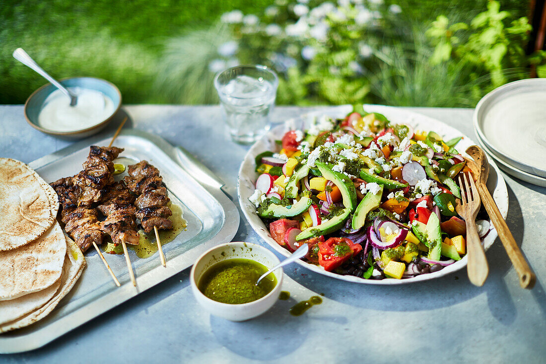 Souvlaki with pita bread and Greek summer salad with feta, souvlaki