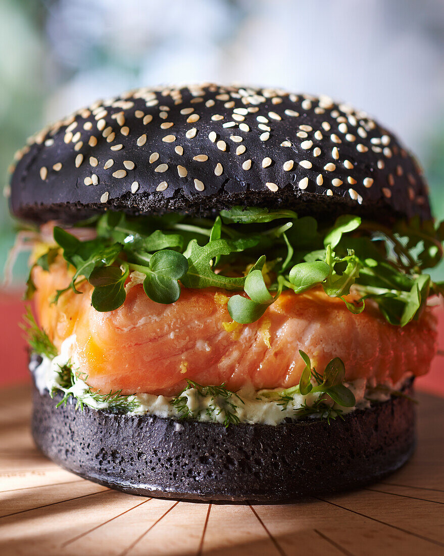 Salmon burger on black bun