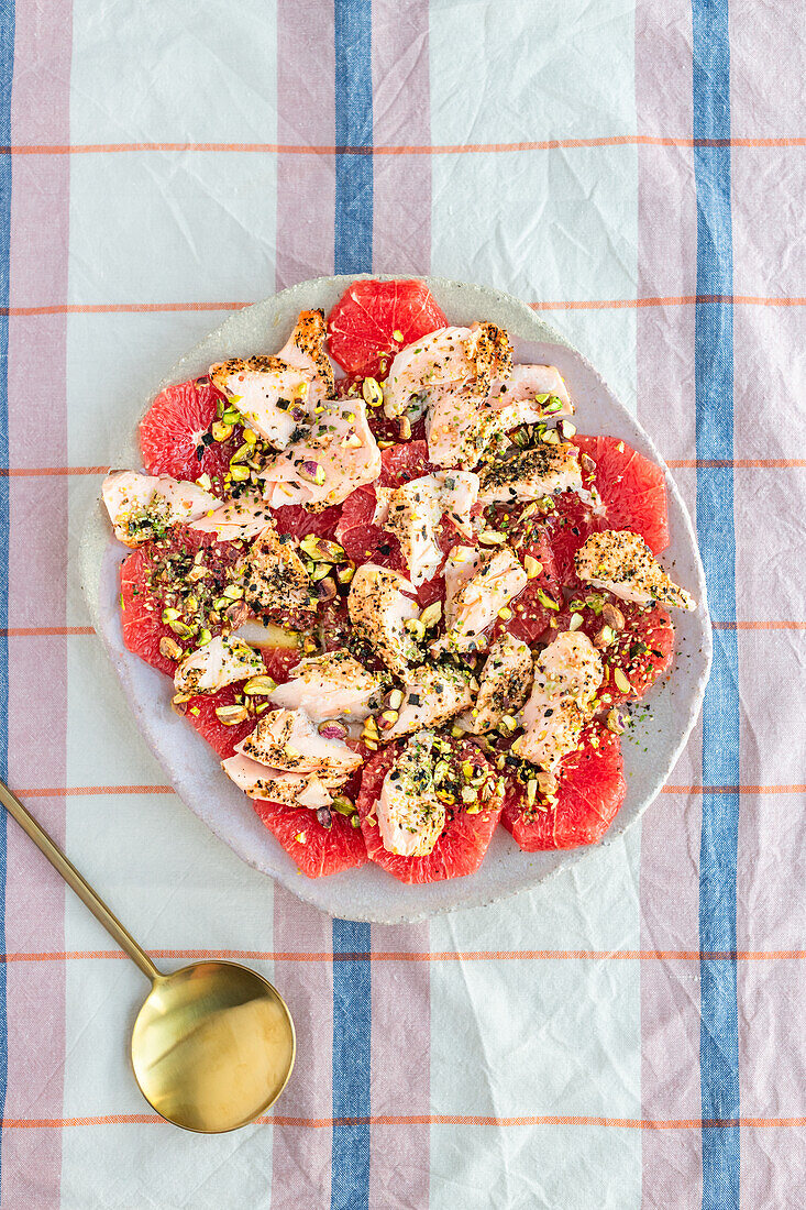 Grapefruit salad with grilled salmon, pistachios, and nori furikake