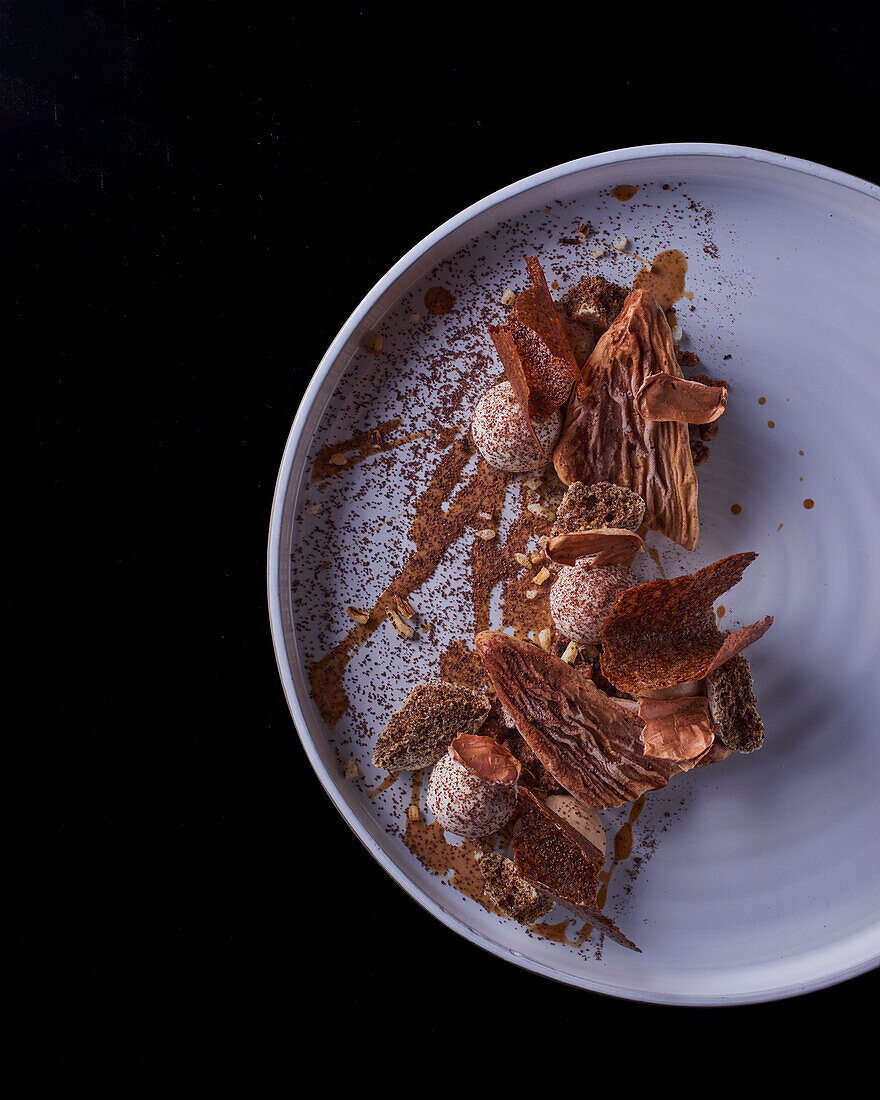 Chocolate dessert with cocoa bean and meringue