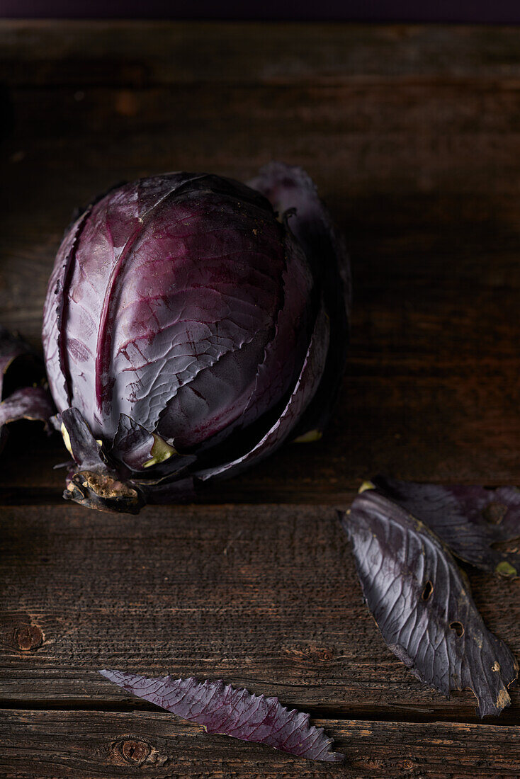 Red cabbage on a wooden background