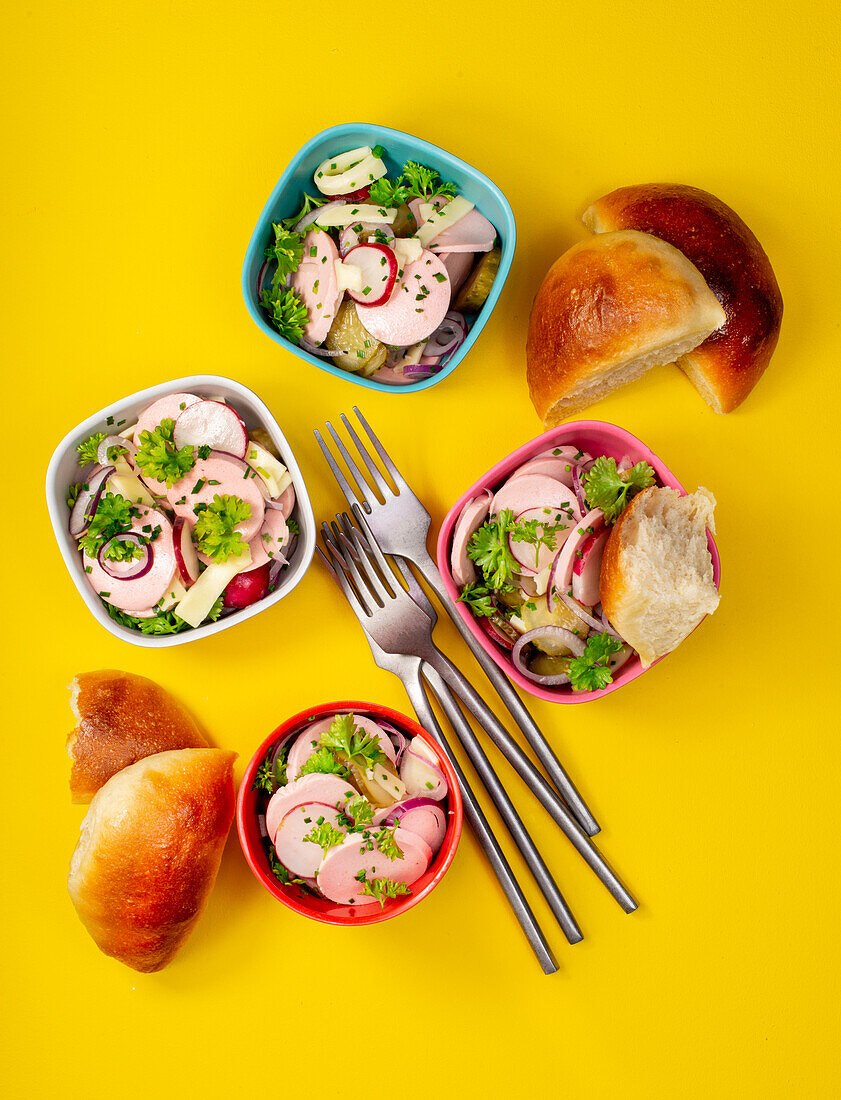 Swiss salad, made from vegan sausage substitute, with cheese and vegan bread roll