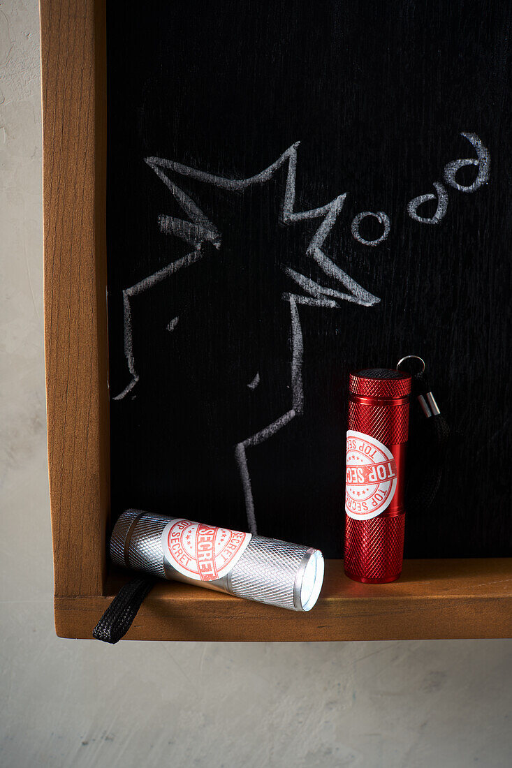 Torches and chalkboard with detective sketch