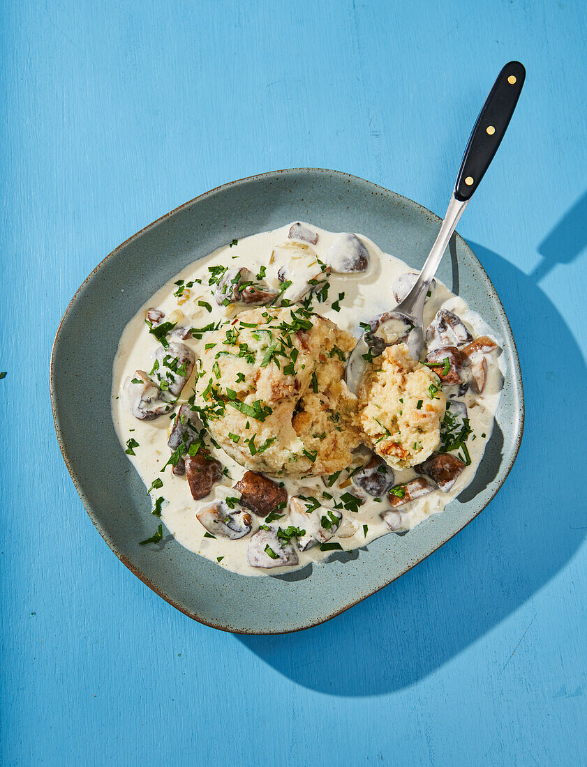 Bread dumplings on vegan mushroom sauce