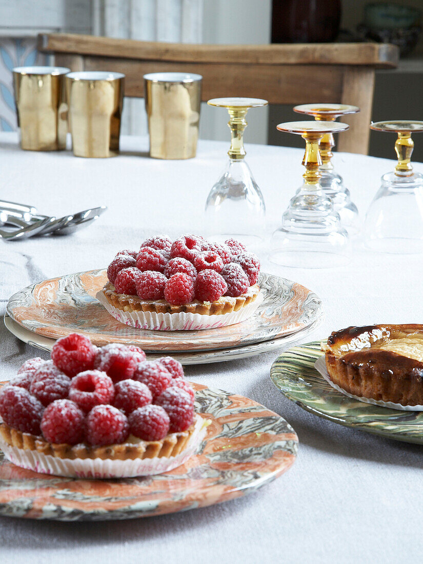Tabletop with raspberry tarts