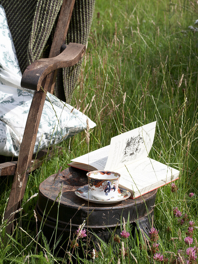 Chair and side table in a meadow