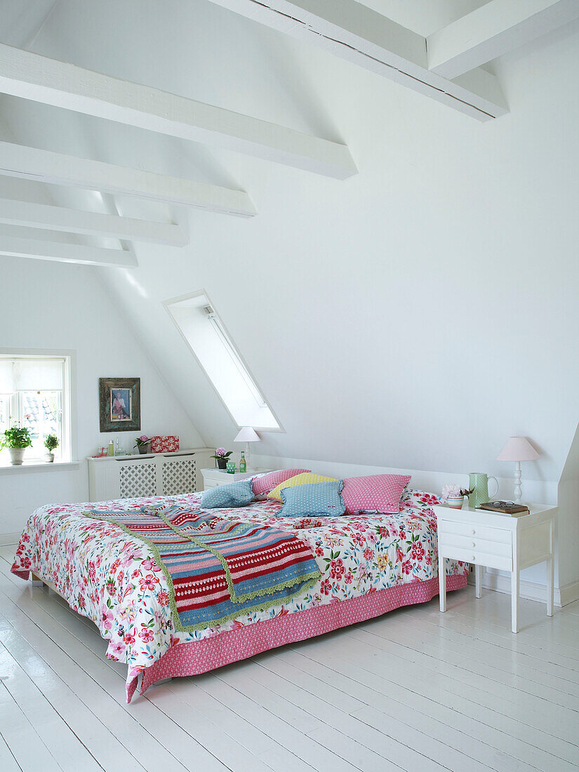 Colourful whitewashed bedroom