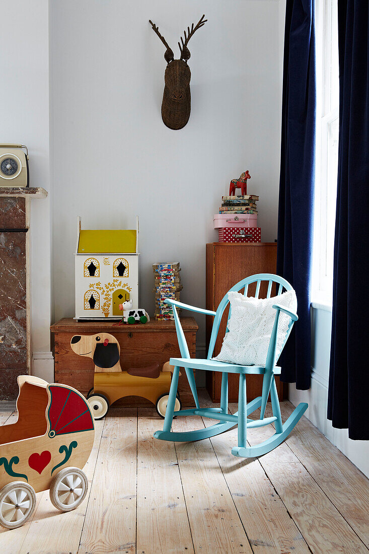 painted rocking chair and toys in Colchester family home, Essex, England, UK