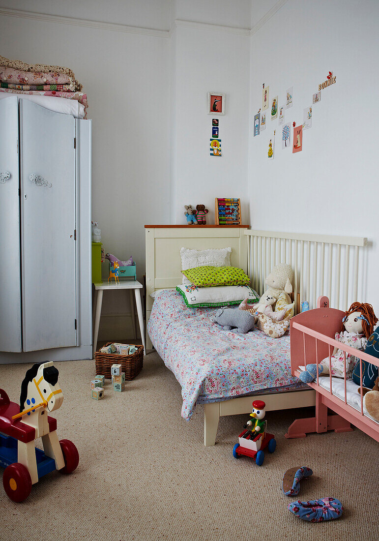 Toy horse and soft toys in girl's room of Colchester family home, Essex, England, UK