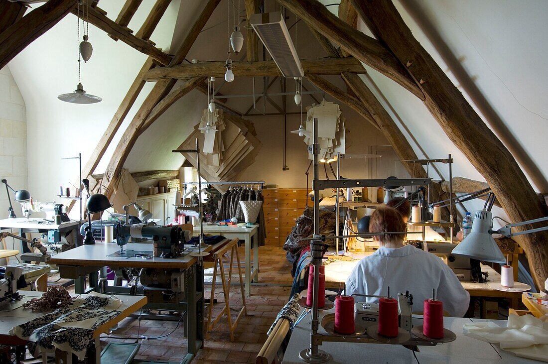 Two women sewing in fashion design studio
