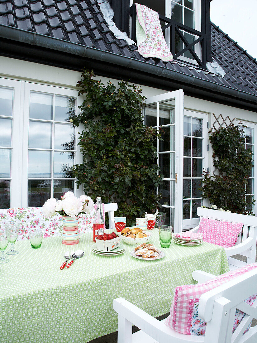 Crockery and tableware on a garden table on a summers day