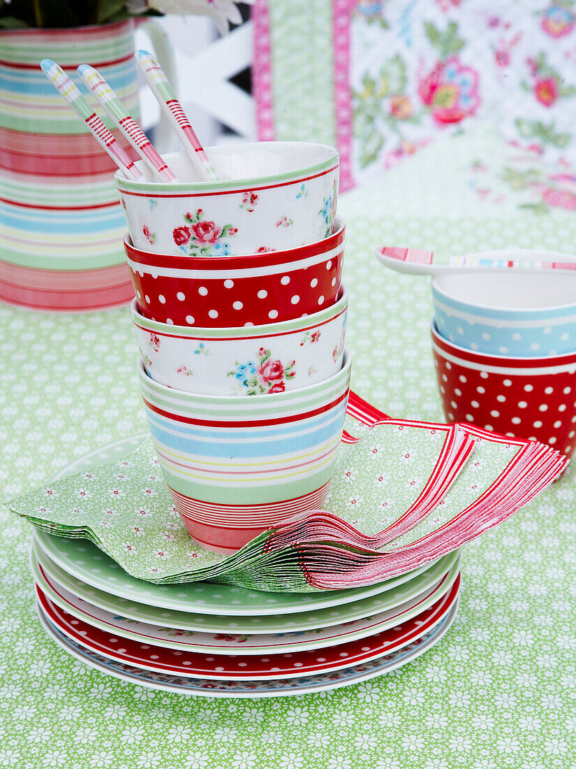 Crockery and tableware on a garden table on a summers day