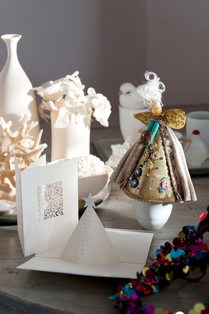 Christmas card and decorations on table