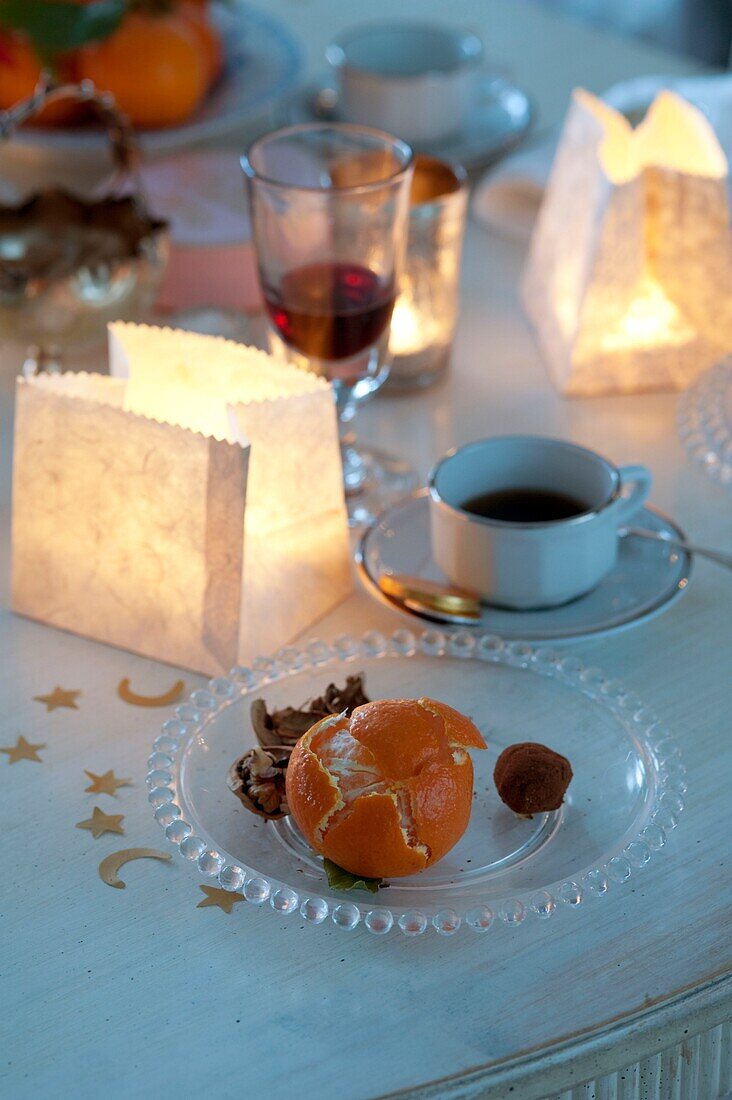 Orange and coffee on Christmas dining room table