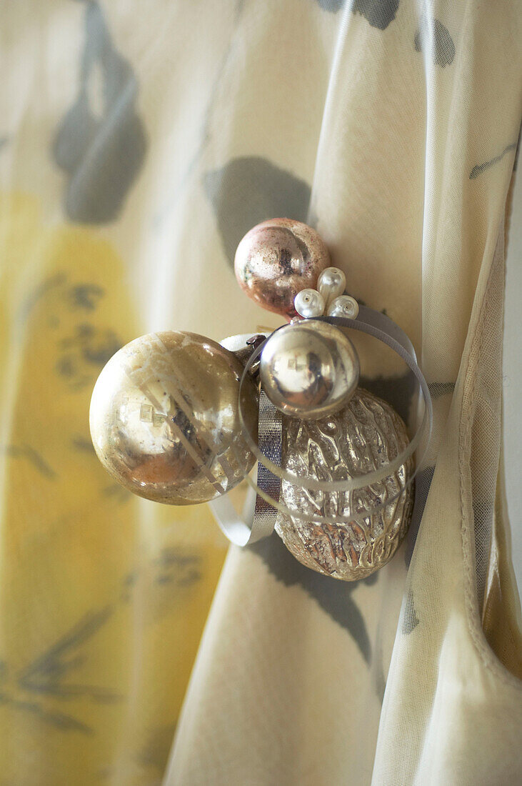 shiny christmas bauble brooch detail on dress