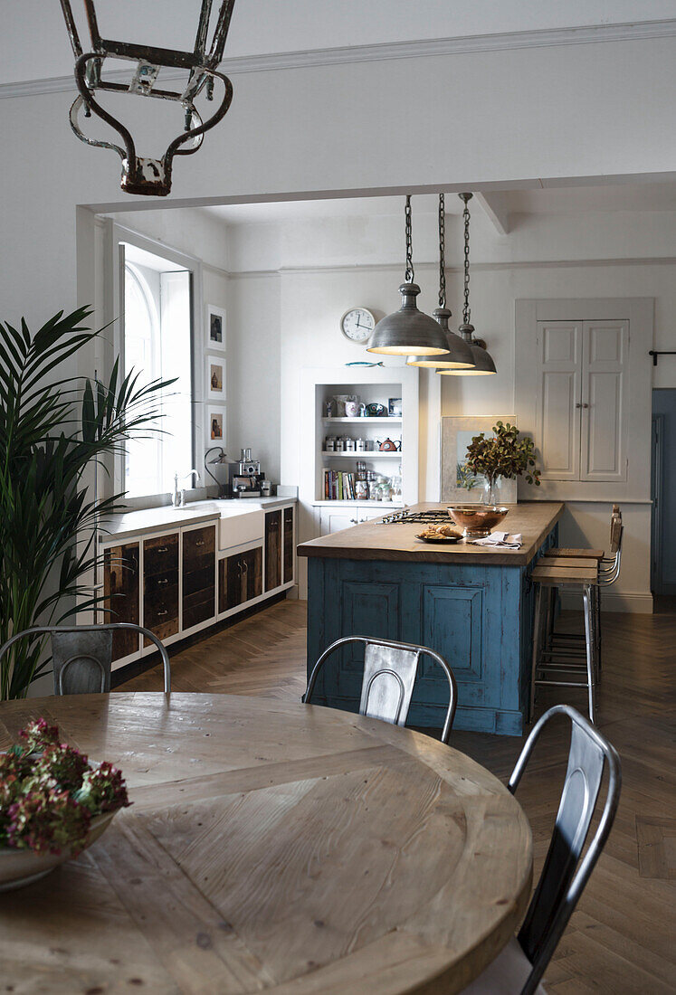 Wooden table in open plan Somerset kitchen UK