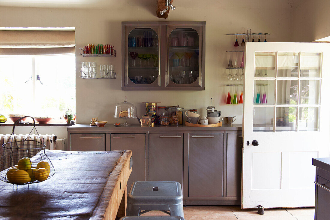 Contemporary metallic units in Iden farmhouse kitchen, Rye, East Sussex, UK