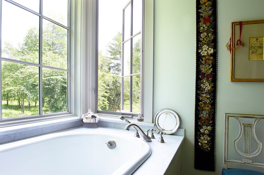 Open window above bath in Massachusetts home, New England, USA