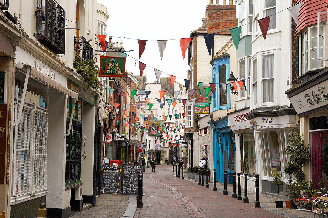 Pedestrianised Hastings street shop windows with flag bunting