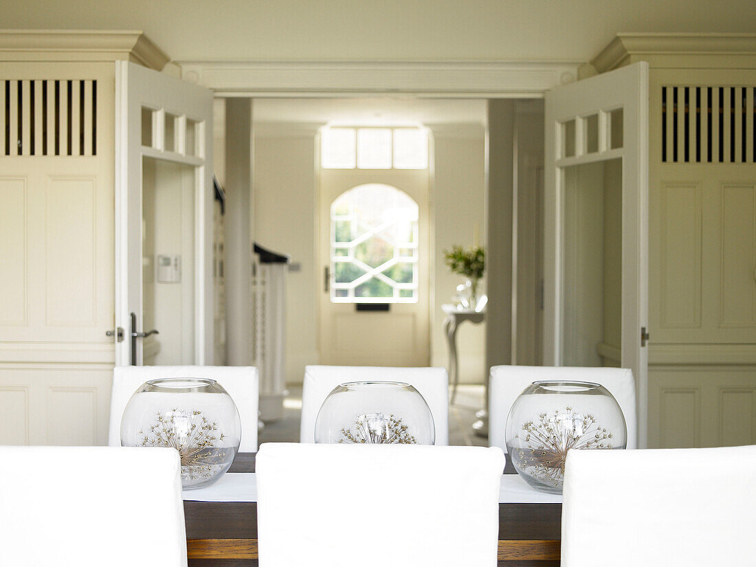 Dining room interior, building entrance in background