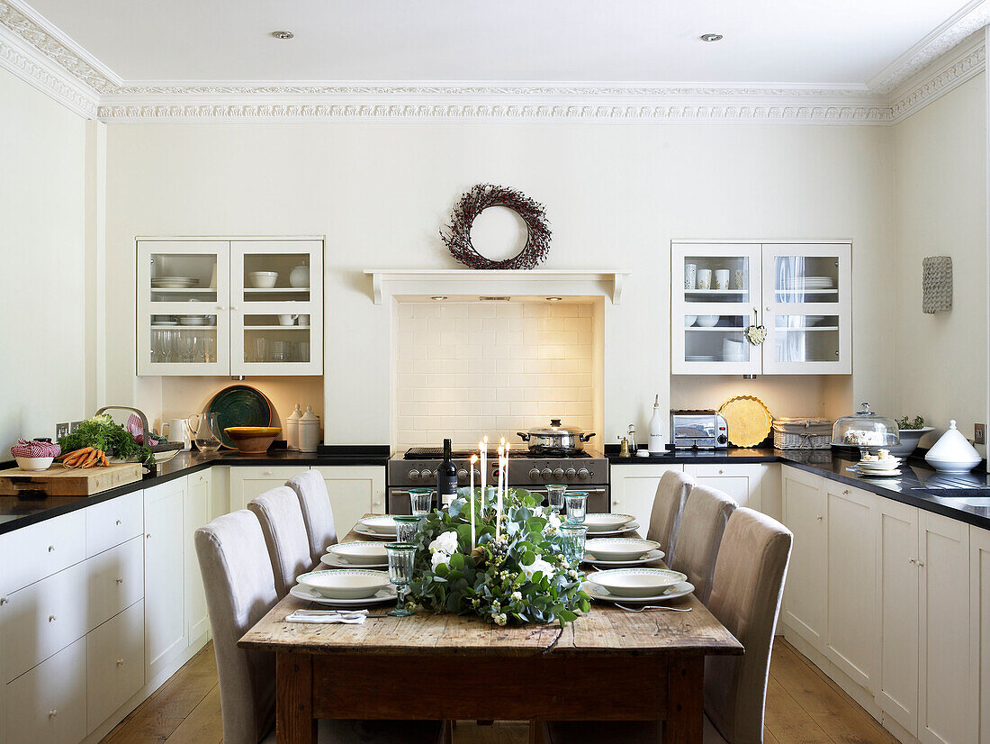 Dining table in a kitchen laid for Christmas lunch