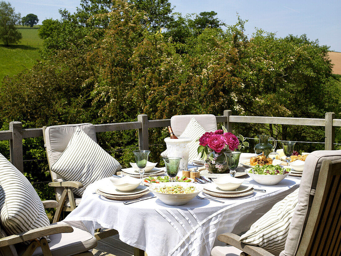 Al fresco dining on balcony of Somerset new build rural England UK