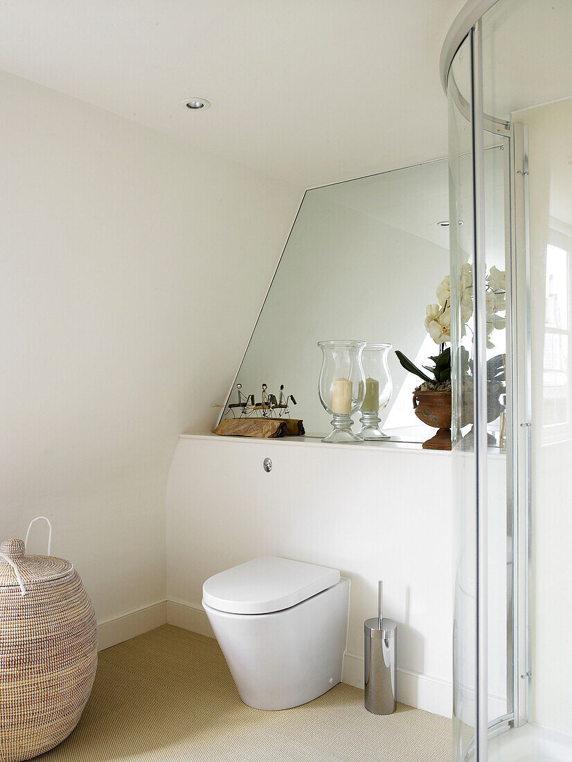 Mirrored wall and shower cubicle in bathroom of contemporary Bath home Somerset, England, UK