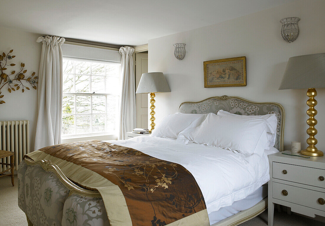 Light grey lamps in bedroom with gold finish city of Bath home Somerset, England, UK