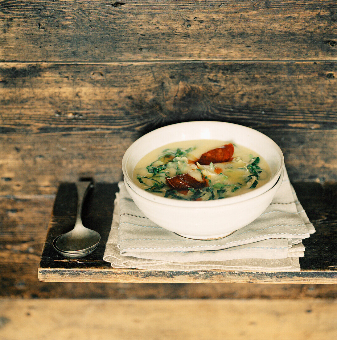 Bowl of stew on a wooden shelf