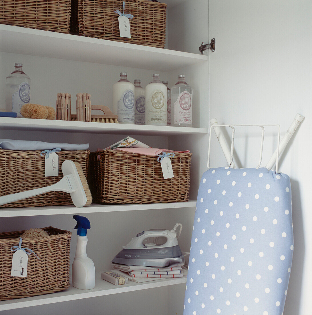 Storage cupboard for laundry and cleaning products