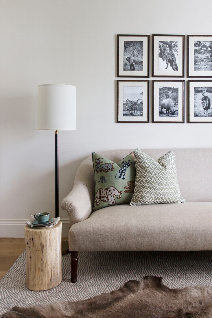 Black and white framed prints above sofa in London home UK