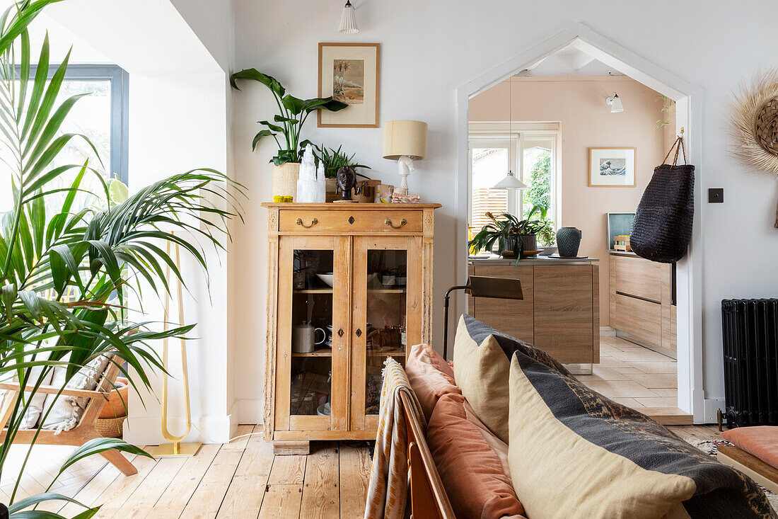 Vintage cabinet with view through doorway to kitchen in Devon cottage