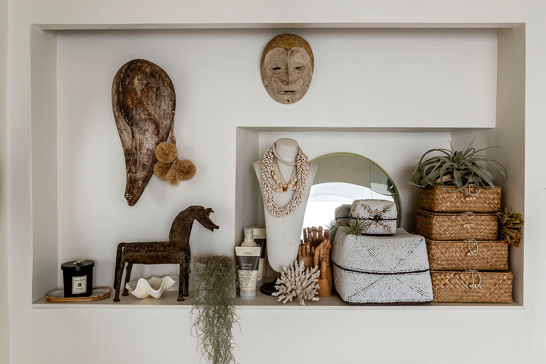 Assorted African artefacts on shelf in Devon cottage