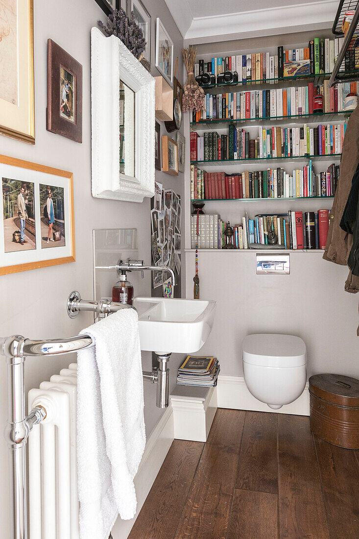 Large collection of books in cloakroom of Winchester home UK