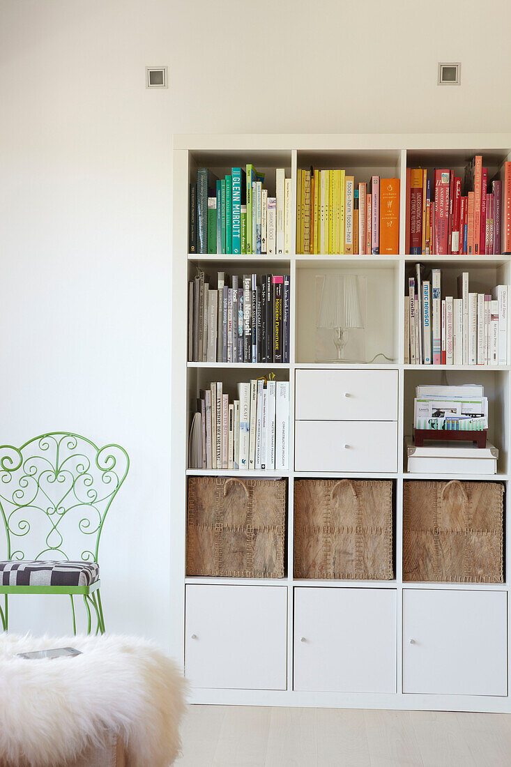 White storage unit and metalworked chair in Sydney apartment Australia