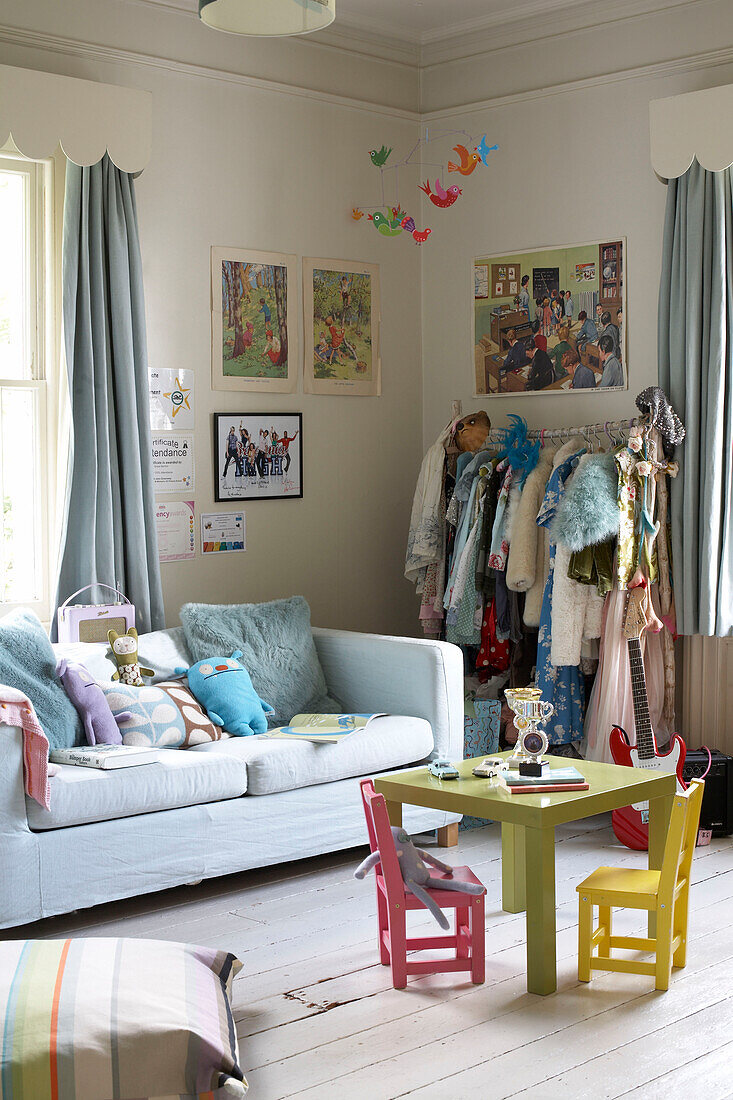 Children's furniture in table with clothes rail and sofa